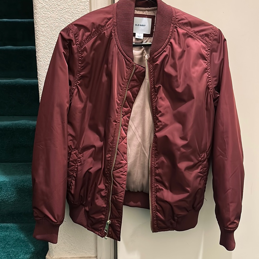 Maroon bomber size small with pink interior lining